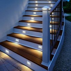 some stairs with lights on them and the steps are lit up in different directions to indicate that there is only one light at the top