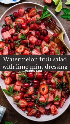 a white plate topped with strawberries and mint