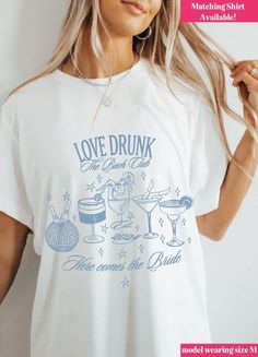 Raise a glass to love with this trendy "Love Drunk" tee. Perfect for celebrating the bride-to-be, this playful top is a must-have for any bachelorette party. Let the good times roll! Don't forget grab the matching shirt for the Bride-to-Be! Bachelorette Party Tshirts, Party Graphic, Let The Good Times Roll, Good Times Roll, Here Comes The Bride, Pj Sets, Matching Shirts, Trending Now, Spring Wedding