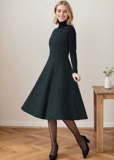 ★★ Welcome to my Ylistyle's shop！！！ The dress features a flattering silhouette with a fitted bodice and a gently flared skirt that falls gracefully to mid-calf length. It has long sleeves and a high round neckline, making it suitable for both formal and casual occasions.  ★★FEATURES * 30% wool, 30% fiber, 40% polyester * Polyester lining * Sleeveless dress * Two side seam pockets * Round neck * Back zipper closure * High waistband * Fit and flare * Perfect for winter, autumn, spring * Dry clean ★★ The model's height approx 170 cm (5′ 7″) with the 84 cm (33") bust, 66 cm (26") waist. She is wearing the wool dress in size XS (US2) ★★ Please select custom order according to the follow situation Can't find your size Your height is over 175cm Your weight is over 75kg Request Length custom Reque Dress With Sweater Underneath, Green A-line Winter Dress, Green A-line Midi Dress For Winter, Green Fit And Flare A-line Sleeveless Dress, Fitted A-line Vintage Dress For Winter, Green Sleeveless Dress For Fall, Fitted Vintage A-line Dress For Winter, Elegant Sleeveless Winter Dresses, Sleeveless Green Midi Dress For Fall