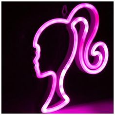 a woman's head is lit up with neon lights