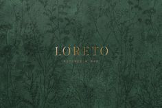 a green background with gold lettering that says loretto on the bottom right corner and flowers in the middle