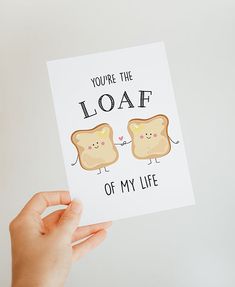 someone holding up a card that says, you're the loaf of my life