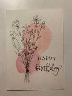 a happy birthday card with watercolor flowers and the words happy birthday written on it