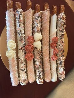 there are many desserts on the plate and one is made out of candy sticks