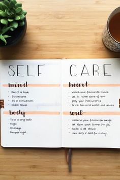 an open self care book sitting on top of a wooden table