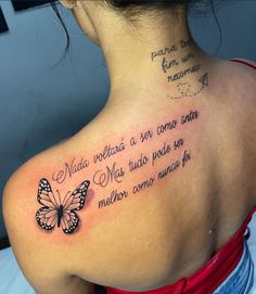 a woman with a butterfly tattoo on her back