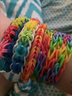 there is a person that has some bracelets on their arm and it looks like they are made out of rubber bands