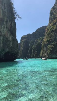 the water is crystal blue and clear with boats floating in it's lagoons