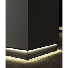 a black box with some lights on top of it and the floor is lit up