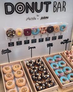 the donuts are on display at the doughnut bar for customers to purchase them