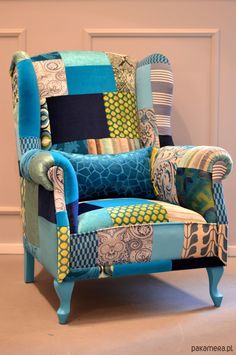 a patchwork chair sitting in front of a door