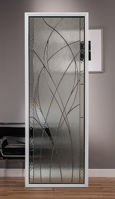 a glass door with an artistic design on the front and side panels that are designed to look like wavy lines