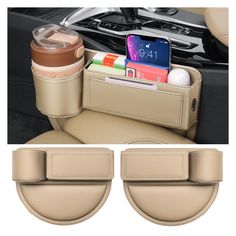 the interior of a car with two cup holders and an open cell phone in it