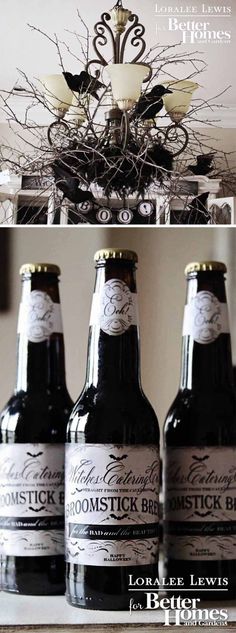 two bottles of beer sitting on top of a table next to each other with branches in the background