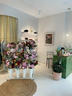 a room filled with lots of different types of flowers