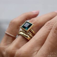 "ITEM DETAILS: Item#: GAR02 Metal: 18K Solid Gold For more information on this ring, please visit: https://www.goldenalchemyfinejewels.com/shop/p/step-cut-blue-topaz ----------------------------------------------------- ✨ CUSTOMIZE YOUR RING! Looking for different options for your ring? We can personalize this band for you with all of the below options. Simply message us for a custom quote and we will get back to you right away. *Available metals: 14K & 18K Solid Gold, Platinum, Palladium. *Available gold colors: White, Yellow, Rose, and Gray. *Available finishes: polished, brushed, hammered, sand-blasted matte, milgrain. ----------------------------------------------------- 💍 UNSURE ABOUT YOUR FINGER SIZE? We offer quality finger ring size gauges with free shipping to help you determine Gold Rings With Gemstone In Brass, Gold Emerald-cut Blue Topaz Ring, Gold Emerald-cut Heirloom Topaz Ring, Poison Ring Secret Compartment, Luxury Brass Rings With Gemstone, Modernist Gold Gemstone Jewelry, Poison Ring, Blue Topaz, Rings Statement