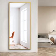 an orange chair is in front of a white room with a large mirror on the wall