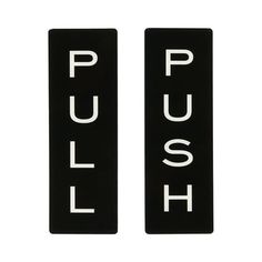 two black and white signs with the word push written on each one's side