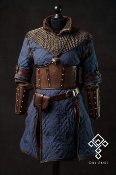 a blue and brown medieval outfit on a mannequin