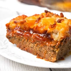 a piece of meatloaf on a white plate