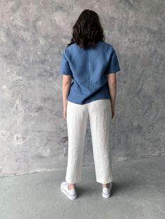 "Handmade washed linen top with short sleeves. Made with love for You. *100% local medium weight linen *Washed eco-friendly linen *Each item is individually cut and sewn by order *The model is wearing size L, blouse color - Blue *Note that colors may look different on your display depending on their settings and technical characteristics. Please let us know if you need different measurements or colors. CARE *Machine wash up to 40 / 104F gentle cycle *Iron inside out at medium high *Do not bleach Blue Linen V-neck Blouse, Casual V-neck Tops In Ramie, Casual V-neck Ramie Top, Casual Short Sleeve Ramie Tops, Casual Linen Short Sleeve Tops, Casual Short Sleeve Linen Tops, Blue Linen Short Sleeve Top, Summer Linen Short Sleeve Blouse, Casual Blue Linen Blouse