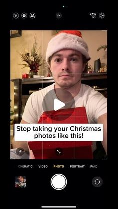 a man wearing a santa hat and holding a red box with the words stop taking your christmas photos like this