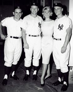 a group of baseball players standing next to each other