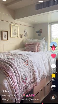 a bed with white sheets and pink pillows