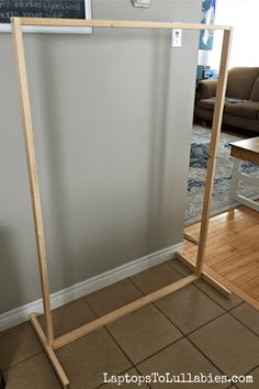 a wooden frame for a coat rack in a living room