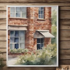 a watercolor painting of a brick house with white awnings on the windows