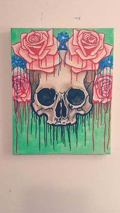 a painting of a skull with roses on it's head is hanging on the wall