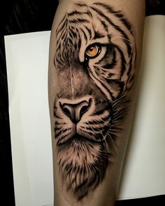 a black and white tiger tattoo on the leg