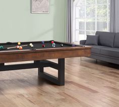 a pool table in the middle of a living room