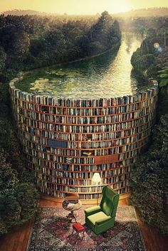 a green chair sitting in front of a giant book shelf