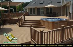 a hot tub sitting on top of a wooden deck