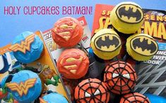 there are many cupcakes that have been made to look like batman and spiderman