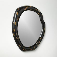 a mirror that is shaped like an oval