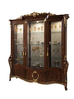 an ornate display cabinet with glass doors