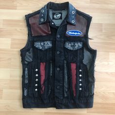 Denim Hard Rock Punk vest made by Lone Gunman Clothing. Leather and denim patchwork for a unique rock n roll look. Hours of details for this one of a kind piece. The bozo backprint is cut out of an offical merchandise product. Size Medium. Armpit to armpit approx 48cm. Punk Style Denim Vest For Fall Streetwear, Punk Style Vest For Streetwear In Fall, Punk Denim Vest For Fall Streetwear, Punk Sleeveless Denim Vest For Streetwear, Cotton Grunge Denim Vest For Streetwear, Rocker Style Fitted Vest For Streetwear, Black Rocker Style Vest For Streetwear, Distressed Punk Denim Vest For Streetwear, Punk Distressed Denim Vest For Streetwear