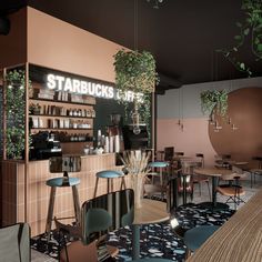 the interior of a starbucks coffee shop with plants hanging from the ceiling and wooden tables