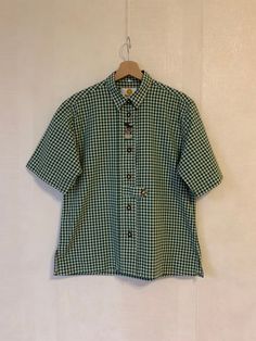 Vintage Gray Moss Green Women Checkered Blouse Loden Shirt Short Sleeve Blouse Button up Trachten Shirt Austrian Shirt Size Medium to Large Label size: 40 Estimated size: M/L Measurements (lying flat): Shoulders: 17,5"/ 44 cm Sleeve: 11,5"/ 29 cm Pit to pit: 21.5"/ 55 cm Waist: 21"/ 53 cm Length: 26.5"/ 67 cm Please check measurements to insure a proper fit. Remember to allow yourself some extra room for movement. You can compare these with something from your closet that fits you well. This blo Checkered Button Down Shirt Outfit, Green Short Sleeve Button Up Outfit, Cheap Vintage Short Sleeve Shirt With Button Closure, Checkered Button Up, Green Checkered Shirt Outfit, Cheap Gingham Shirt With Button Closure, Plaid Button-up Short Sleeve Shirt, Plaid Short Sleeve Button-up Shirt, Plaid Short Sleeve Top With Button Closure