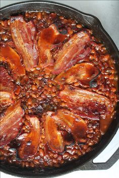 bacon and beans in a cast iron skillet