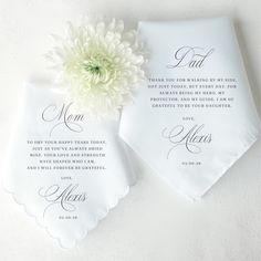 two personalized wedding handkerchiefs with a flower on the front and one in the back