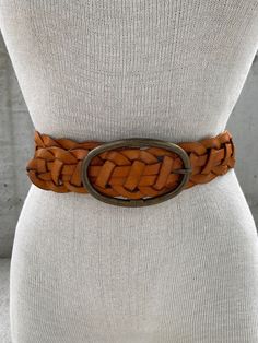 Vintage 1990s Elise M belt, braided brown leather belt, woven tan genuine leather belt, southwestern style, rodeo houston outfit, cowgirl Transport yourself to the rugged and free-spirited vibe of the 1990s with this Vintage Elise M Braided Light Brown Leather Belt, a true gem that captures the essence of southwestern style. Crafted from genuine tan leather, this woven belt features intricate braided details that exude an air of craftsmanship and authenticity. The light brown hue adds warmth and earthiness to your ensemble, making it a perfect choice for both casual and boho-inspired looks. With its unique design and textured appeal, the Vintage Braided Leather Belt is reminiscent of the cowgirl culture that flourished during the rodeo days in Houston and beyond. This belt is the perfect a Adjustable Rustic Brown Belt, Rustic Adjustable Brown Belt, Rustic Brown Adjustable Belt, Vintage Brown Belt For Rodeo, Vintage Brown Belts For Rodeo, Bohemian Brown Belts For Summer, Bohemian Brown Rope Belt, Bohemian Brown Belt For Ranch, Rodeo Houston