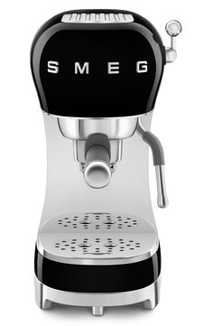 an espresso machine with the word smeg on it