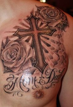 a man with a cross and roses tattoo on his chest