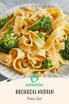 broccoli and noodles on a white plate with the words eat better in front of it