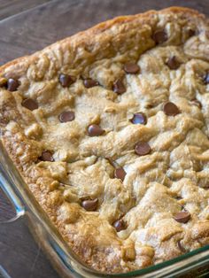 a chocolate chip cookie in a glass baking dish