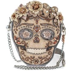 PRICES MAY VARY. Luxurious Design: Enjoy luxurious style with the mixed metallics sugar skull crossbody handbag adorned with hand-beaded metallic florals. Statement Accessory: Elevate any outfit and make a bold fashion statement with this exclusive piece that exudes uniqueness and sophistication. Convenient and Practical: Features a non-removable crossbody chain strap with a padded shoulder piece for comfortable carrying, along with an inside pocket made of vegan leather for added convenience. Q Novelty Handbags, Random Objects, Shoulder Piece, Big Handbags, Sugar Skull Design, Custom Handbags, Mary Frances, Girly Bags